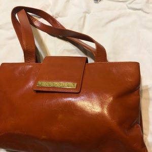 BVLGARI burnt orange purse.